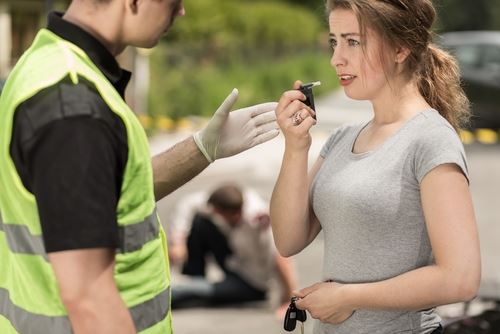 woman with breathalyzer