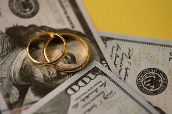 rings lying on top of money